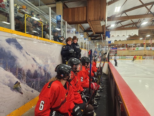 Revelstoke RCMP officers Cst. Emily Hacker and Cst. Rachel Mandel showing community spirit at the hockey game