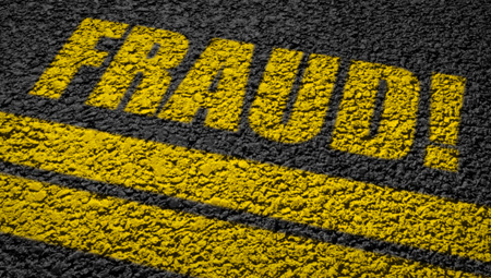 The word "fraud" in yellow writing on a black background