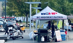 BC Highway Patrol tent with BC Highway Patrol motorcycle